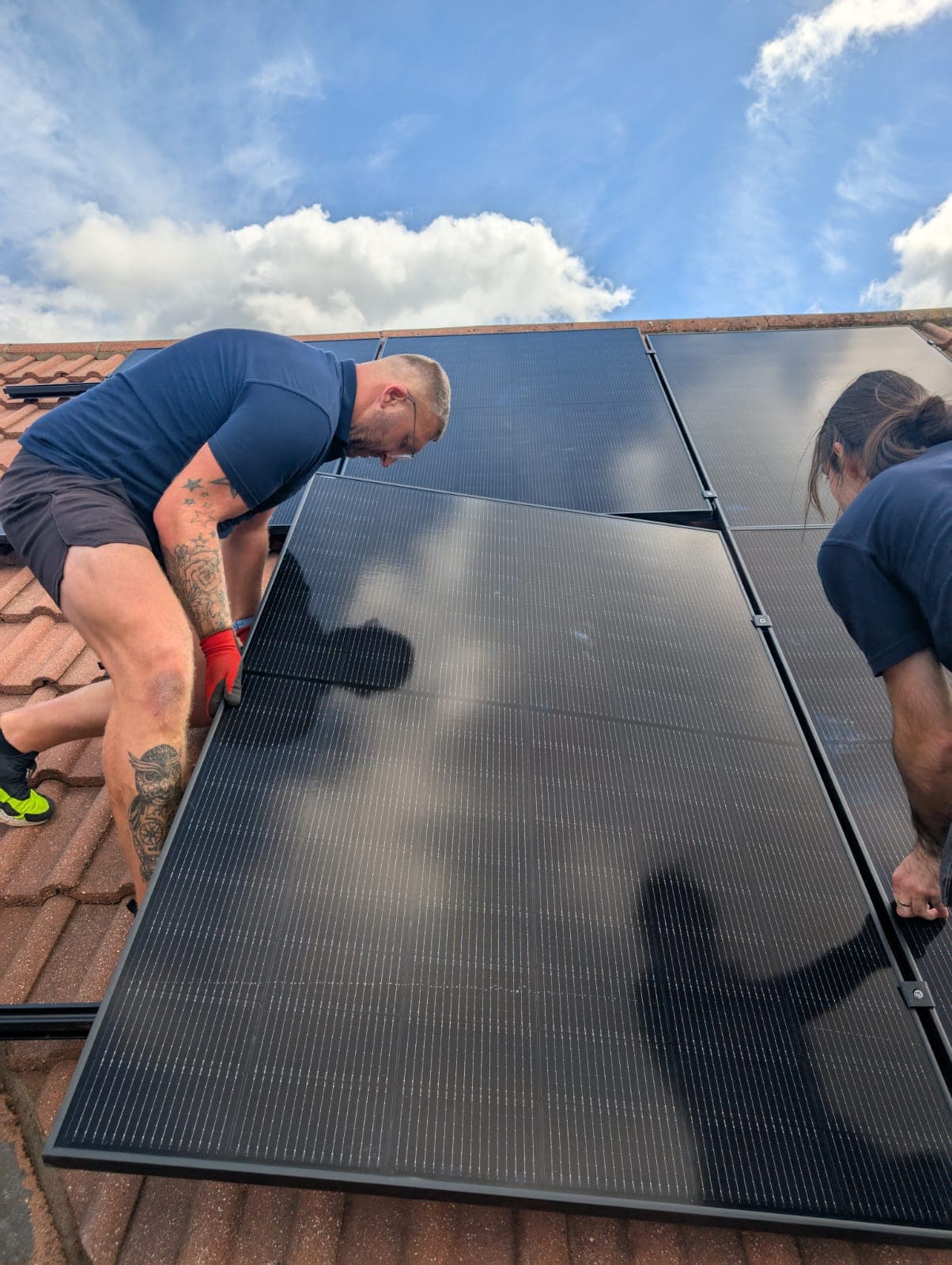 New Gen team members after a completed solar panel install